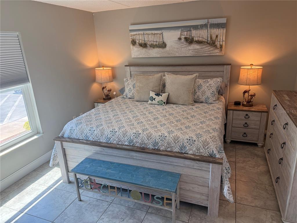 12760 Indian Rocks Road, Unit 1024 Largo, FL 33774 - Photo 26 of 35 a bedroom with a bed and a window