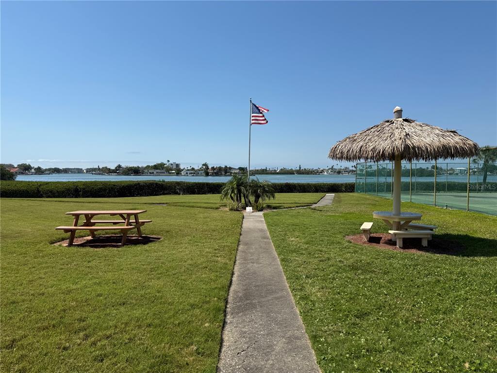 12760 Indian Rocks Road, Unit 1024 Largo, FL 33774 - Photo 28 of 35 a view of a lake with a garden