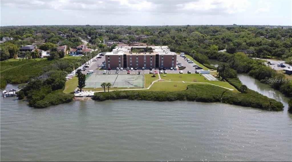 12760 Indian Rocks Road, Unit 1024 Largo, FL 33774 - Photo 5 of 35 an aerial view of a house with a garden and lake view