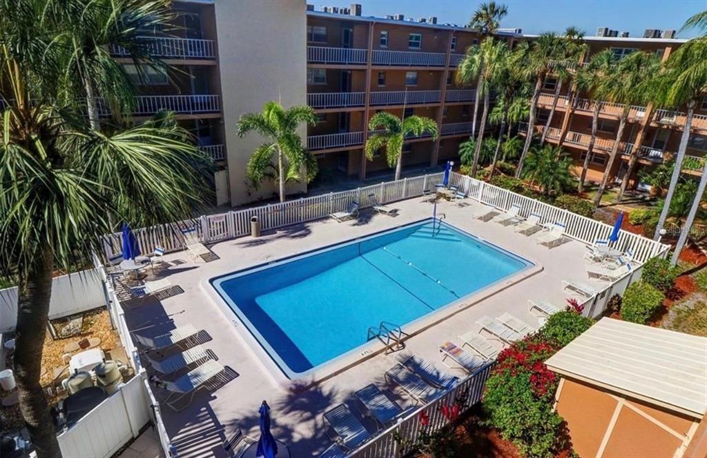 12760 Indian Rocks Road, Unit 1024 Largo, FL 33774 - Photo 7 of 35 a view of a backyard with plants and a patio