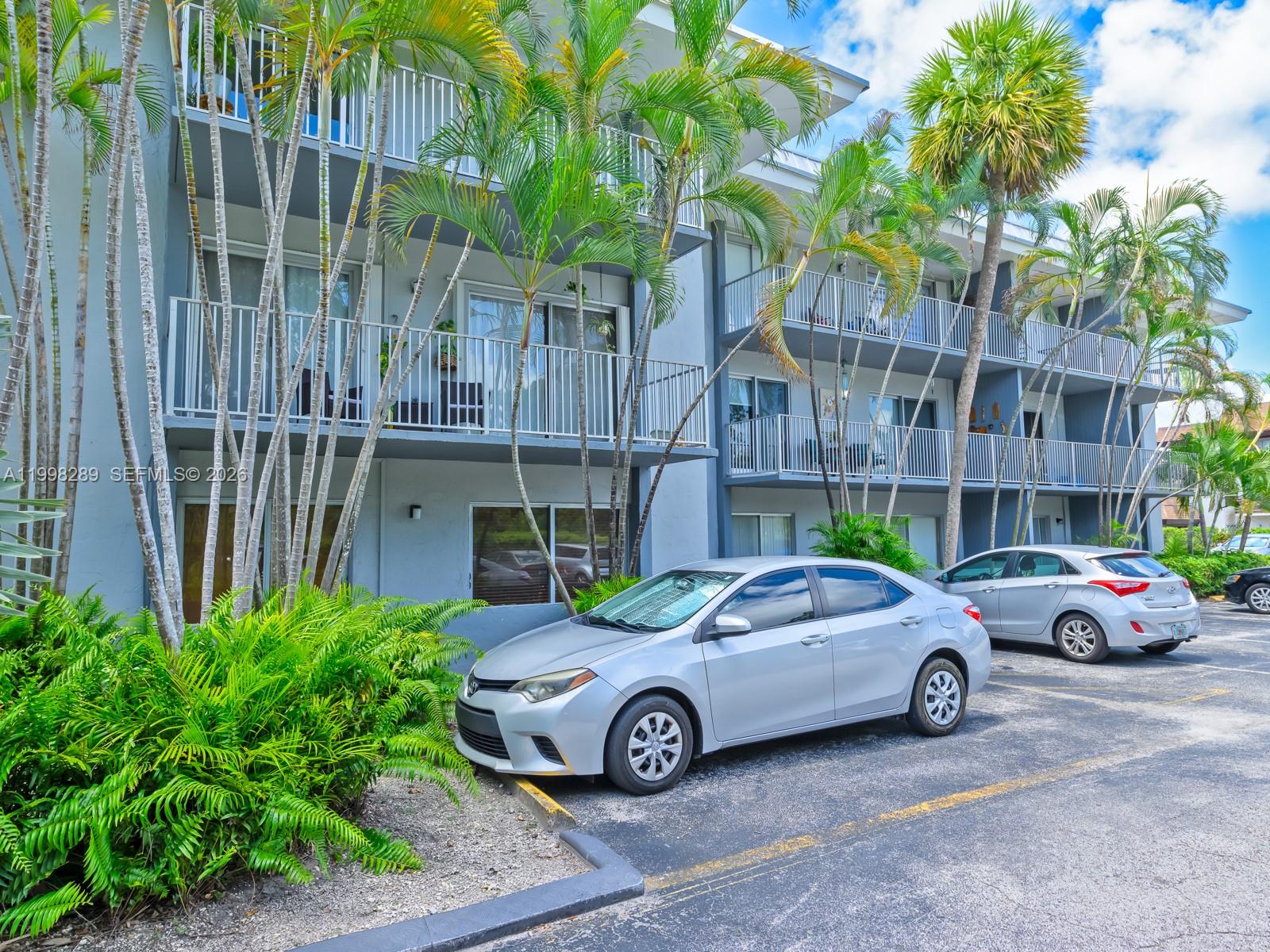 7403 Southwest 82nd Street, Unit 201N Miami, FL 33143 - Photo 35 of 43 a car parked in front of a house
