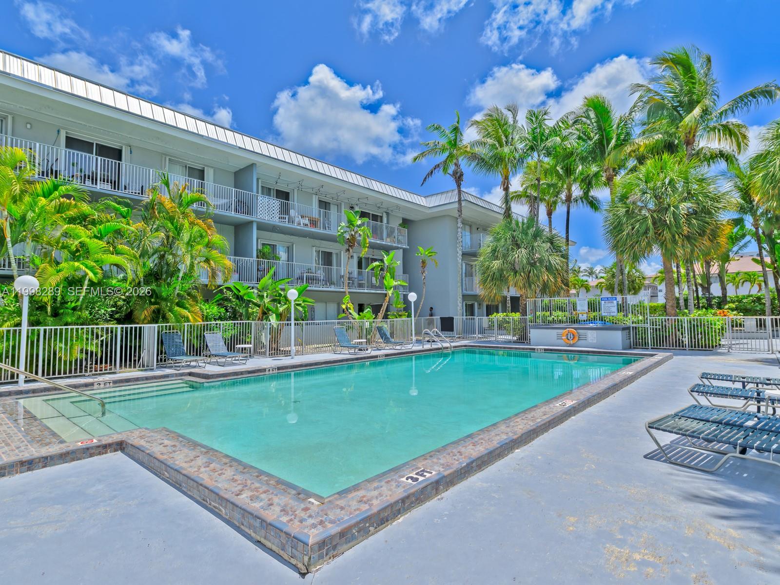7403 Southwest 82nd Street, Unit 201N Miami, FL 33143 - Photo 38 of 43 a view of a backyard with plants and a patio