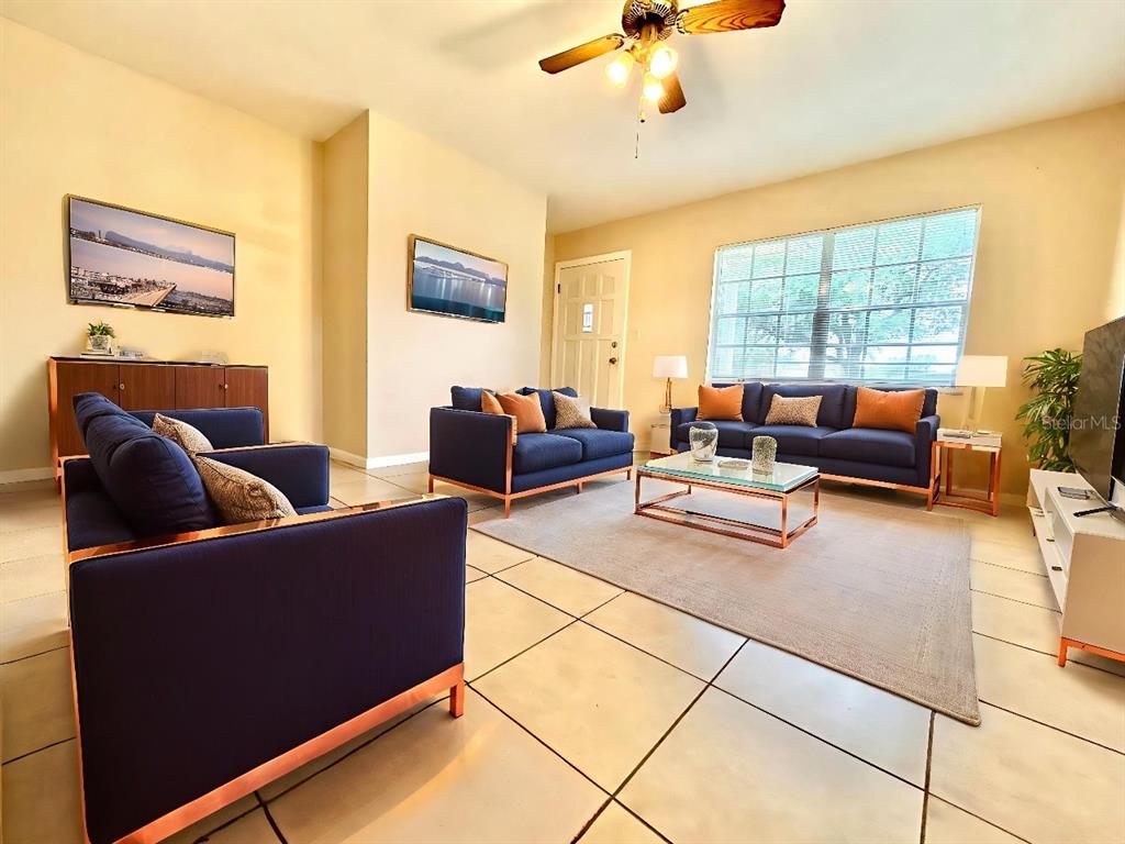 530 Park Avenue, Unit 532 Umatilla, FL 32784 - Photo 3 of 26 a living room with furniture and a large window
