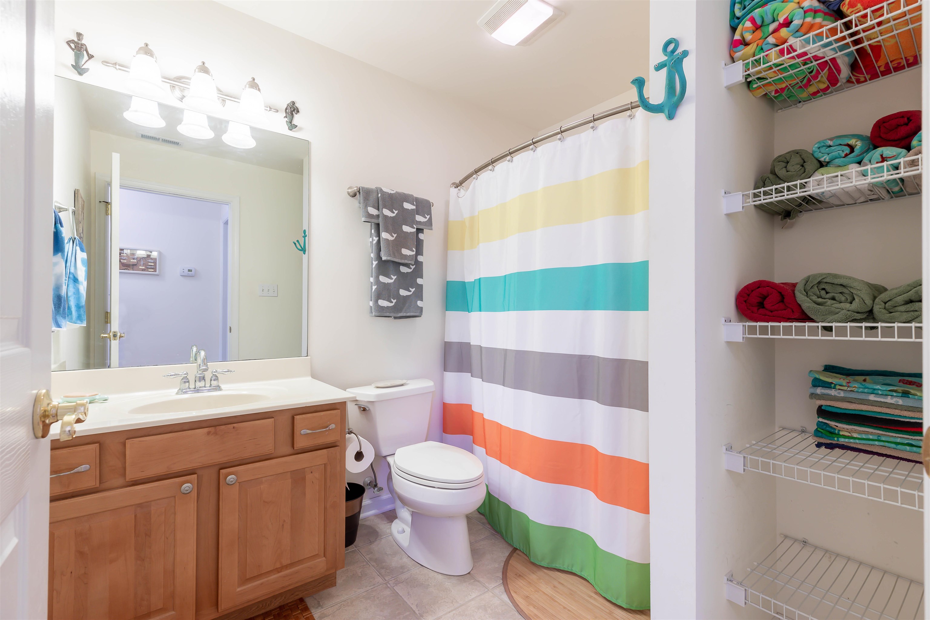 3125 Shunpike Road, Unit A Rio Grande, NJ 08242 - Photo 28 of 41 a bathroom with a sink a toilet and shower curtain