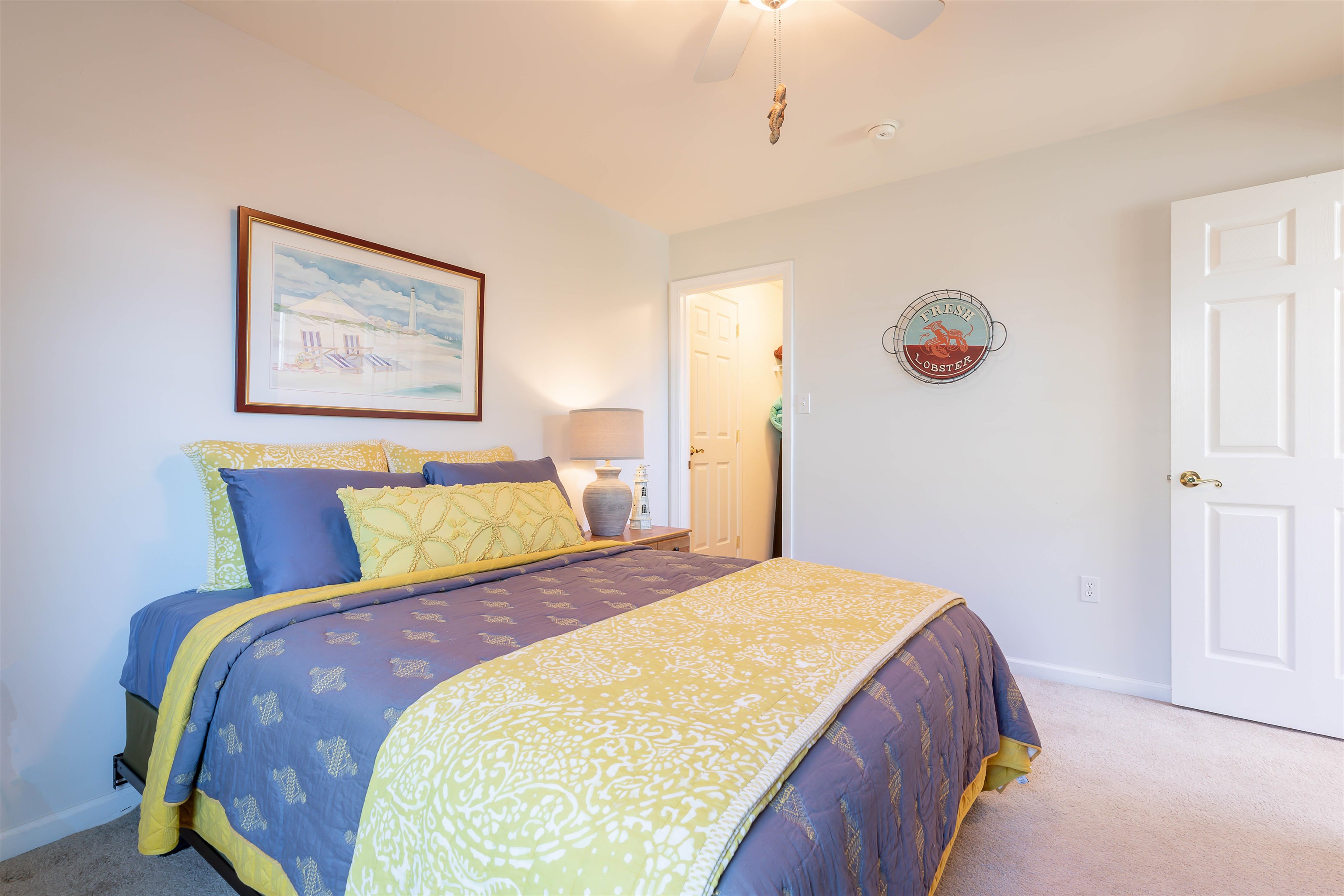 3125 Shunpike Road, Unit A Rio Grande, NJ 08242 - Photo 31 of 41 a bedroom with a bed and a painting on the wall