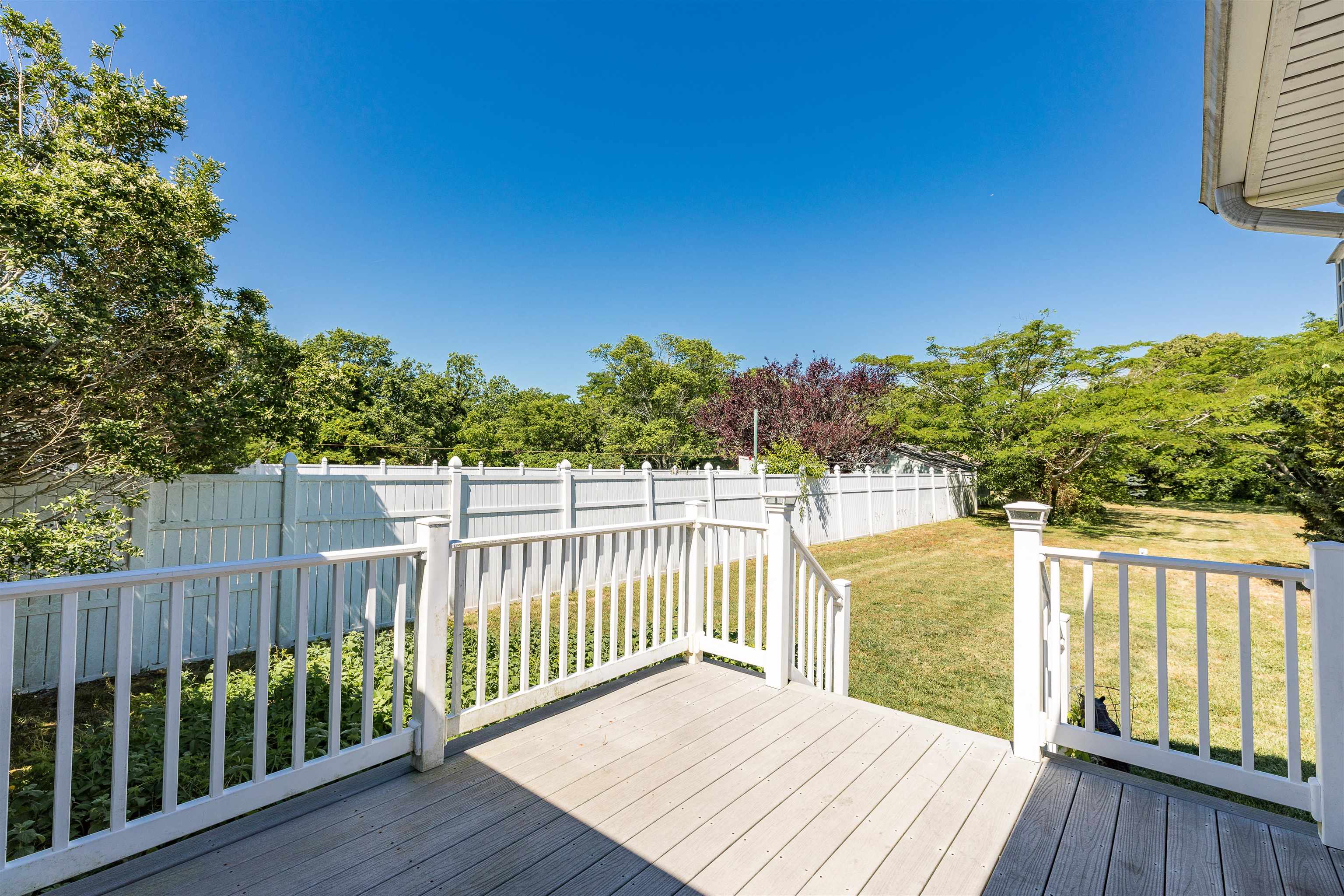 3125 Shunpike Road, Unit A Rio Grande, NJ 08242 - Photo 38 of 41 a balcony with wooden floor and fence