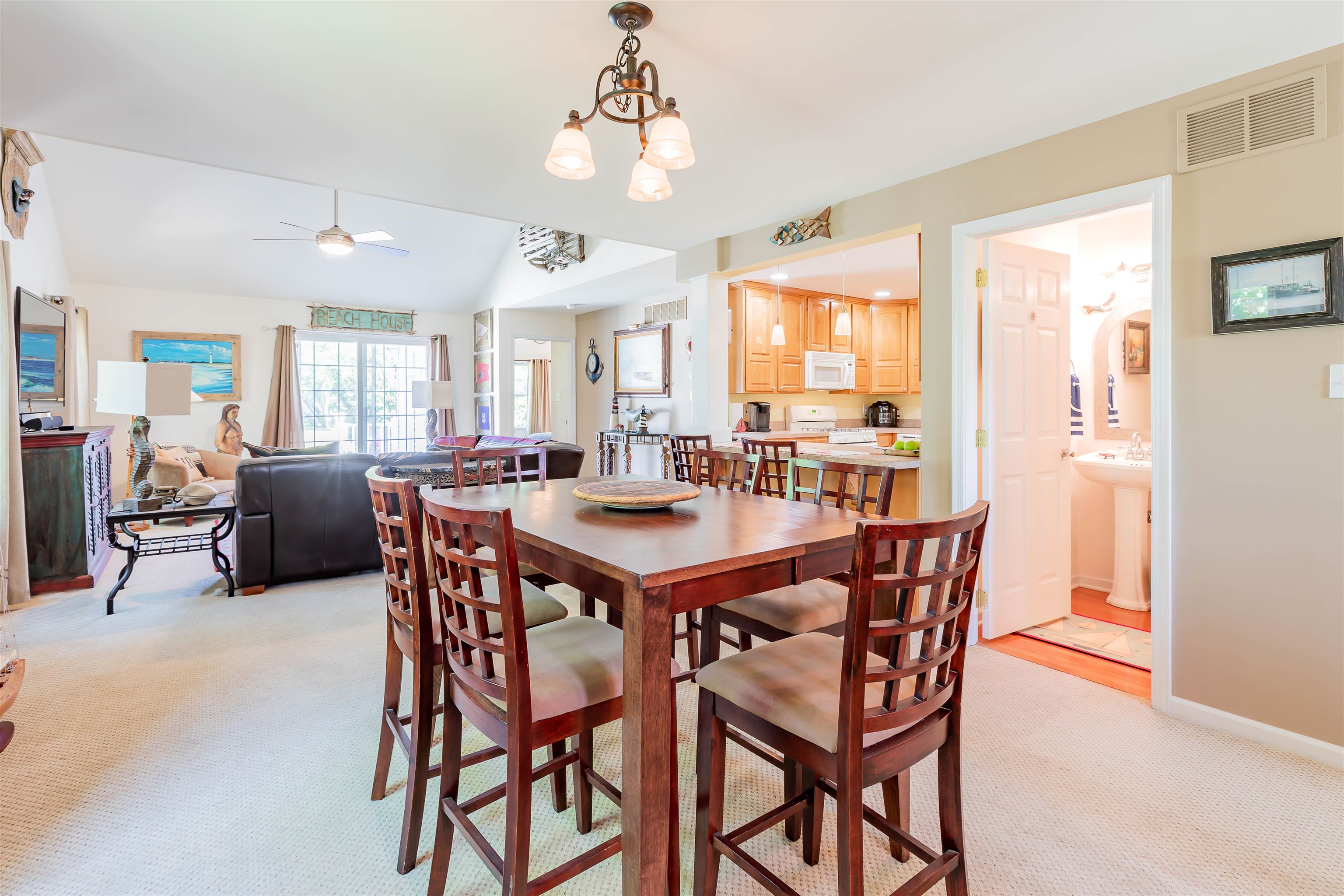 3125 Shunpike Road, Unit A Rio Grande, NJ 08242 - Photo 5 of 41 a view of a dining room with furniture and a chandelier