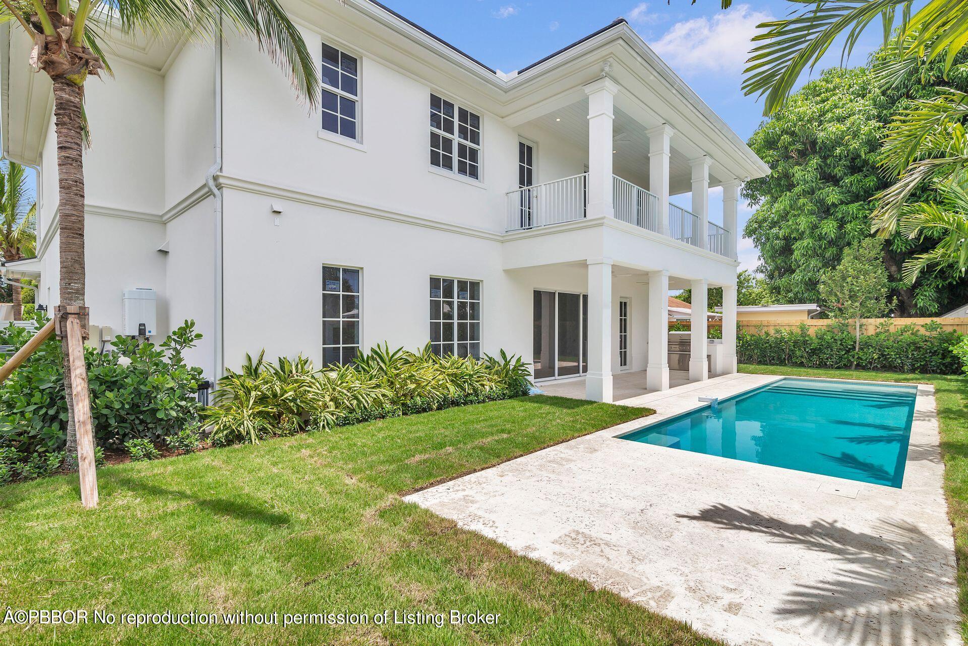 344 Churchill Road West Palm Beach, FL 33405 - Photo 24 of 41 a front view of a house with a yard and potted plants
