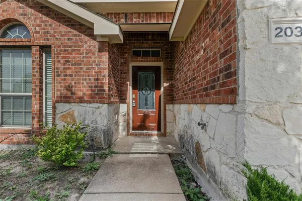 a front view of a house with a door