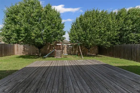 a view of a garden with a slide