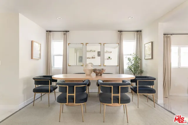 a view of a dining room with chairs and a table