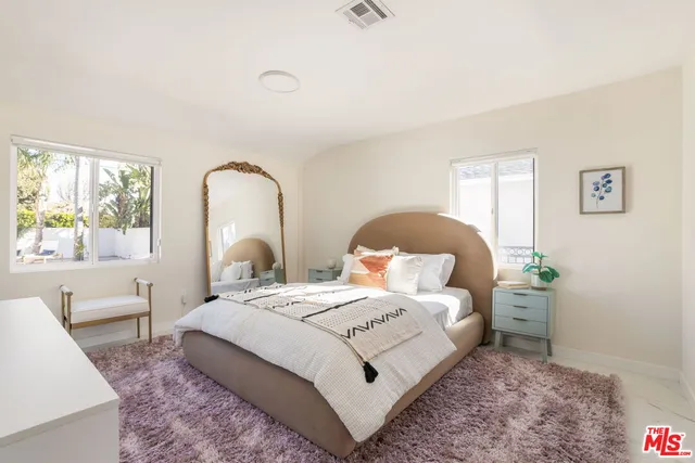 a view of a patio with a table and chairs