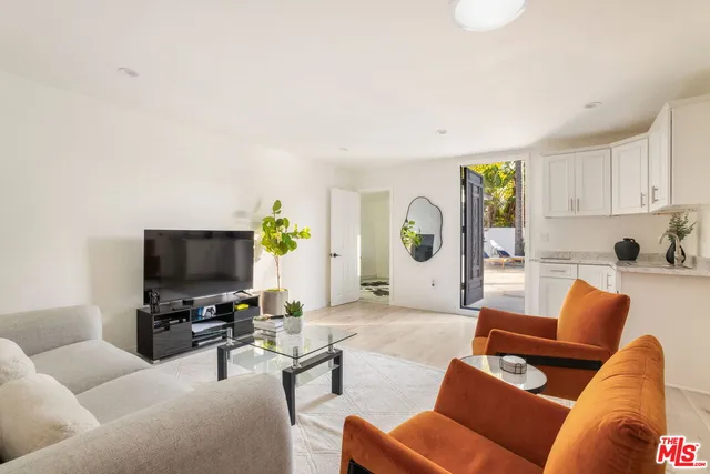 a bathroom with a shower sink vanity and mirror