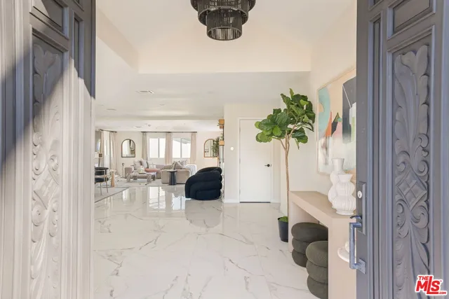 a view of living room with furniture and potted plant