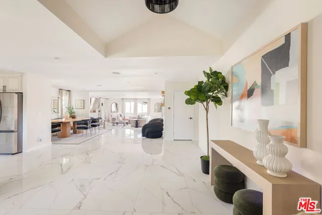 a view of living room with furniture and potted plant