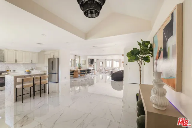 a lobby with furniture and potted plant