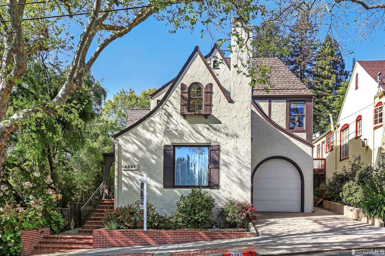 a view of a house with a tree
