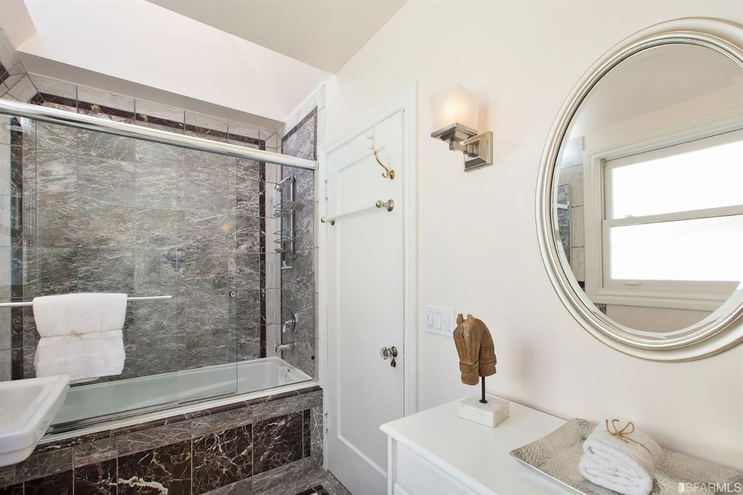 2387 Cedar Street Berkeley, CA 94708 - Photo 17 of 76 a bathroom with a sink a toilet and a mirror