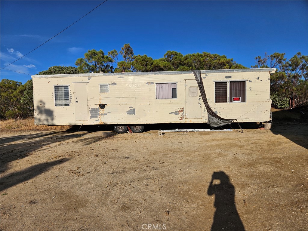 59600 Burnt Valley Road Anza, CA 92539 - Photo 14 of 22 a view of a house with a yard