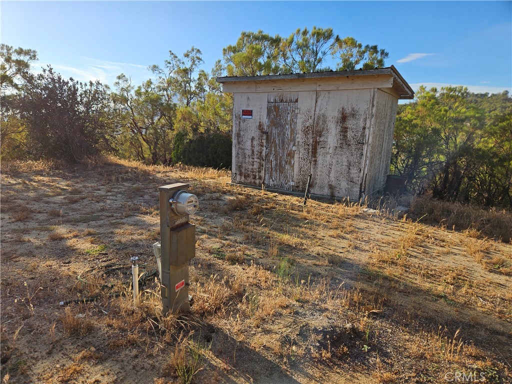59600 Burnt Valley Road Anza, CA 92539 - Photo 16 of 22 a view of a house with a yard