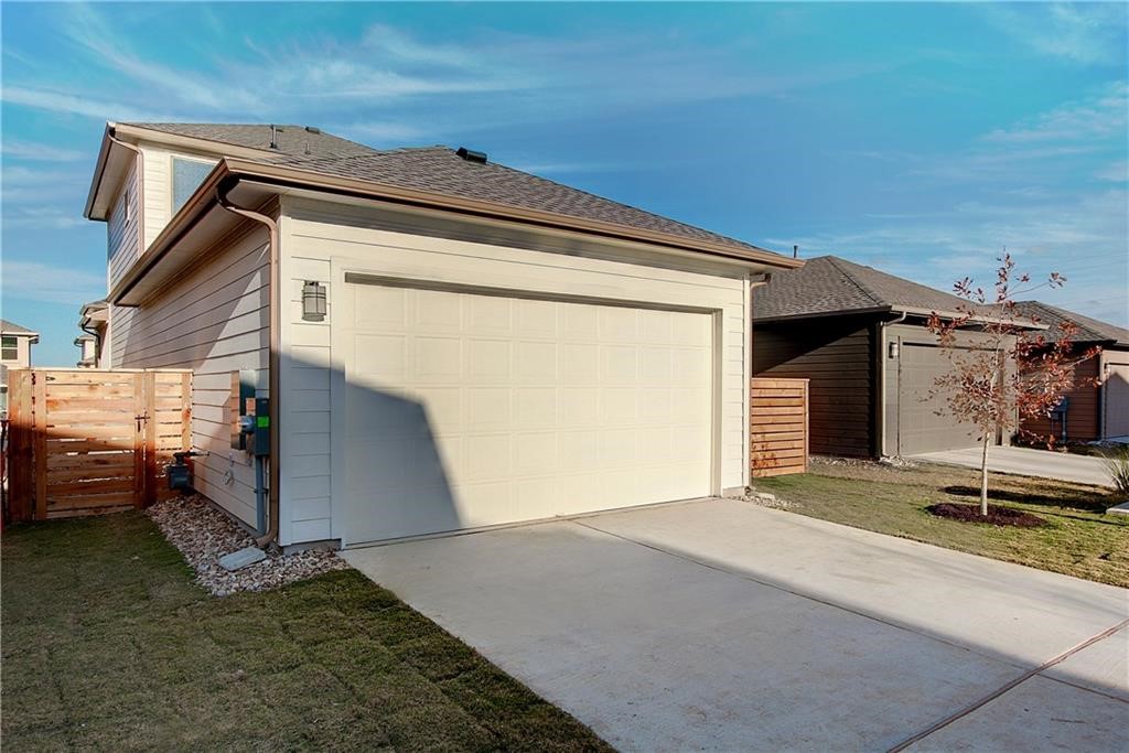 6907 Idea Road Austin, TX 78741 - Photo 29 of 29 Side alley access to 2-car garage with driveway for additional parking.