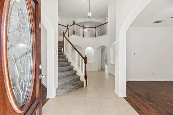 a view of a hallway with staircase