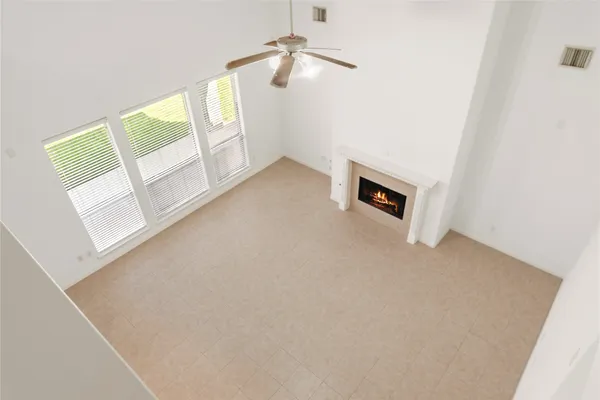 a view of an empty room with windows