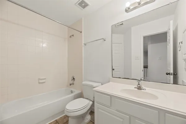 a bathroom with a sink a toilet and a bathtub