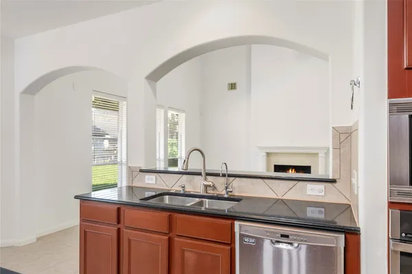a kitchen with sink and window