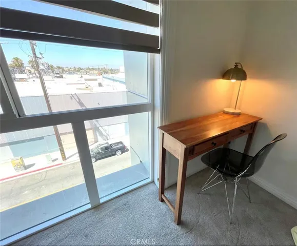 a bathroom with a toilet sink vanity and mirror