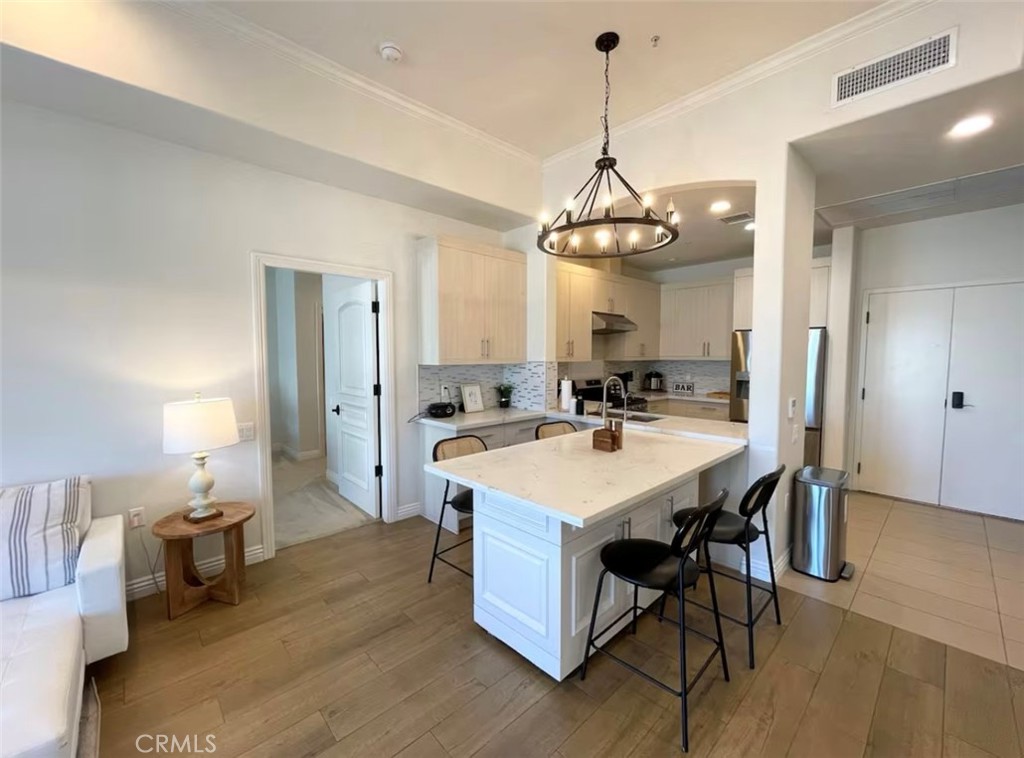 1598 Long Beach Boulevard, Unit 412 Long Beach, CA 90813 - Photo 6 of 31 a large kitchen with a table and chairs