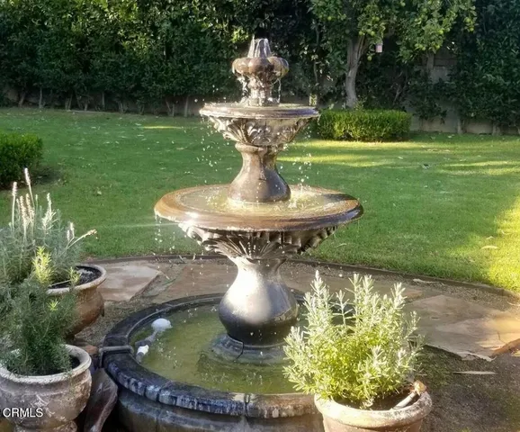 a view of a fountain in the yard with a fountain