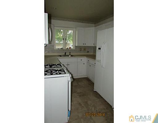 25 Fordham Road Old Bridge, NJ 08859 - Photo 8 of 25 a kitchen with a sink cabinets and a window