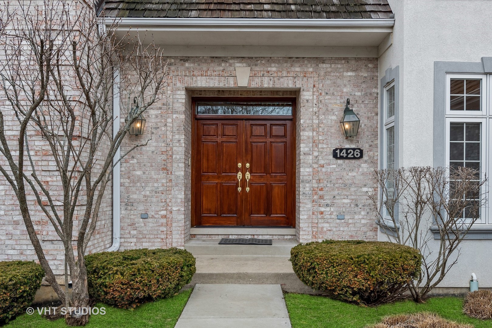 1426 Linden Road Northbrook, IL 60062 - Photo 2 of 27 a front view of a house with garden