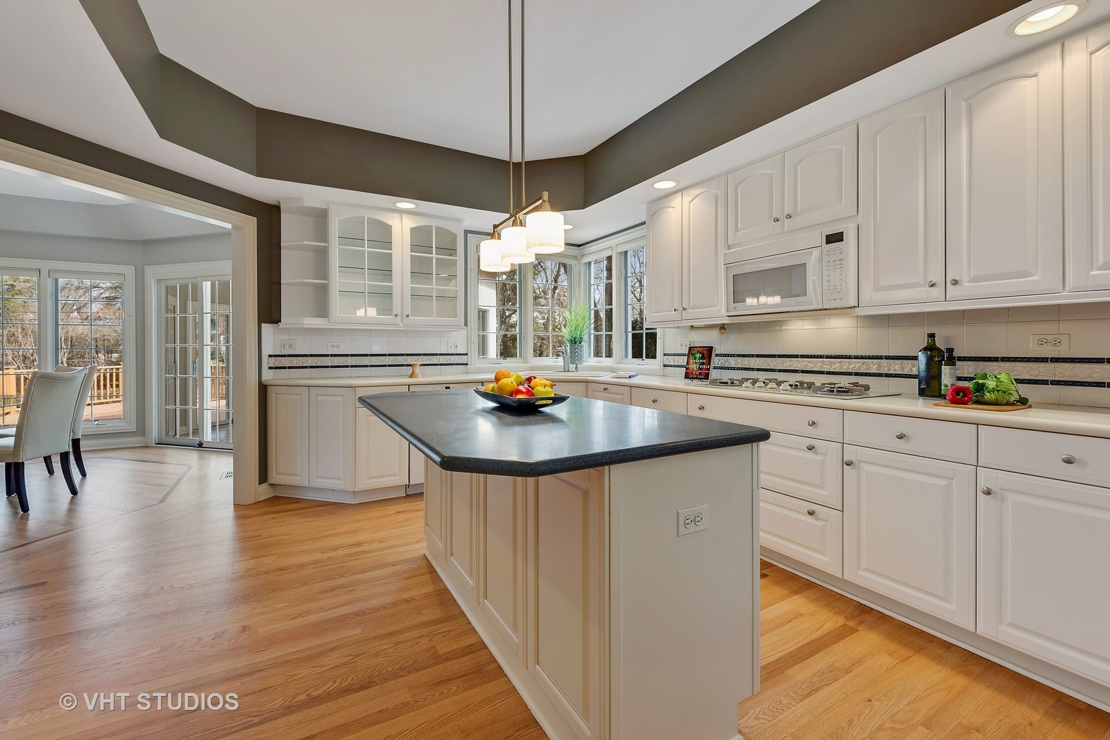 1426 Linden Road Northbrook, IL 60062 - Photo 12 of 27 a kitchen with stainless steel appliances granite countertop a sink stove and refrigerator