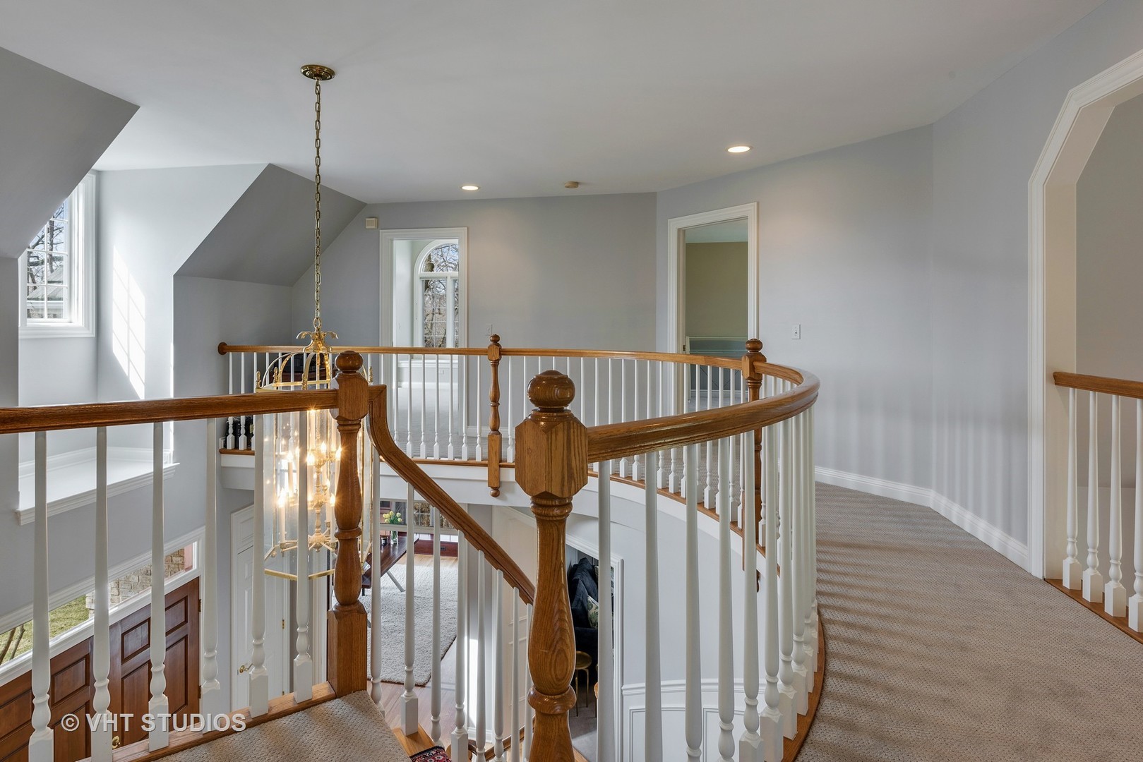 1426 Linden Road Northbrook, IL 60062 - Photo 14 of 27 a view of staircase with lots of frames on wall and stairs
