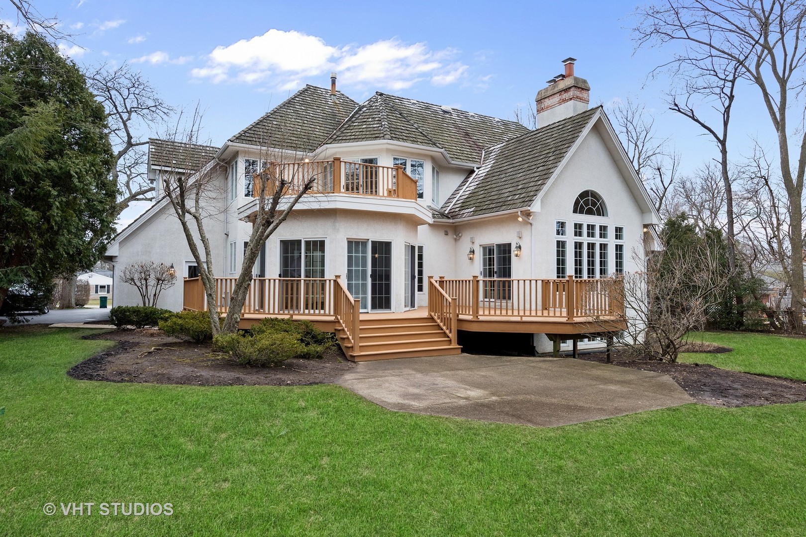 1426 Linden Road Northbrook, IL 60062 - Photo 23 of 27 a front view of a house with a garden and trees