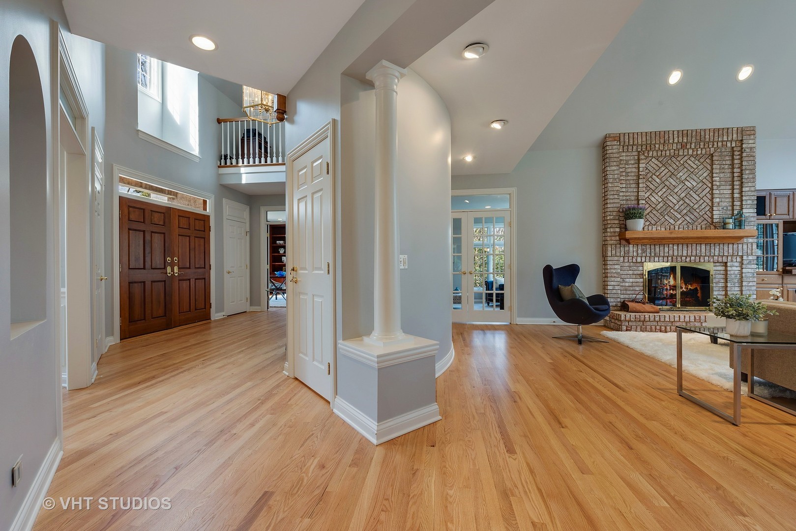 1426 Linden Road Northbrook, IL 60062 - Photo 4 of 27 a living room with furniture a fireplace and a wooden floor