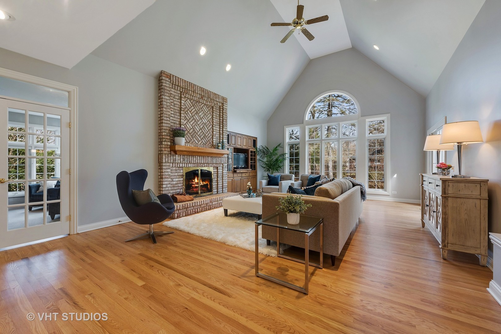 1426 Linden Road Northbrook, IL 60062 - Photo 6 of 27 a living room with furniture a fireplace and a large window