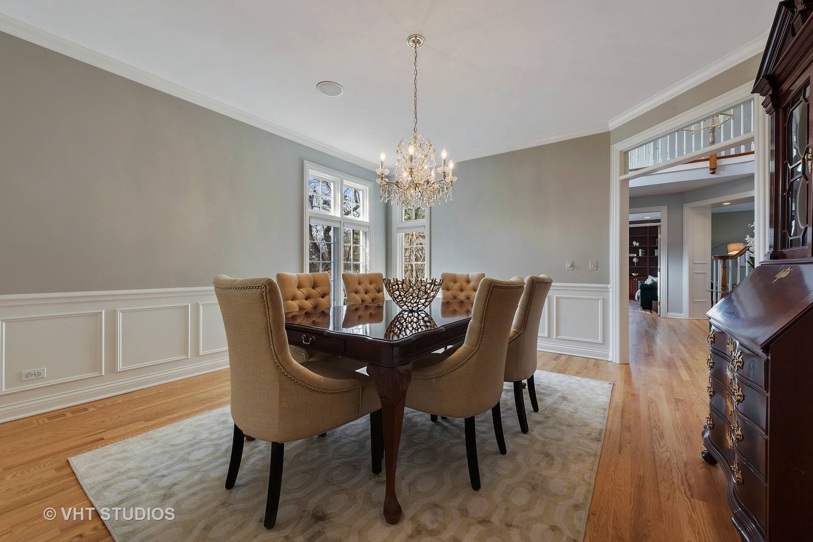 1426 Linden Road Northbrook, IL 60062 - Photo 10 of 27 a dining room with furniture a chandelier and wooden floor