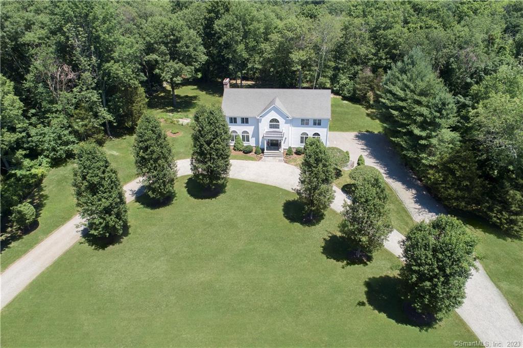 10 Fox Run Wilton, CT 06897 - Photo 1 of 1 an aerial view of a house with swimming pool and garden