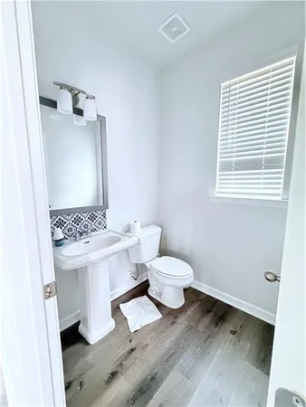 a bathroom with a sink toilet and vanity