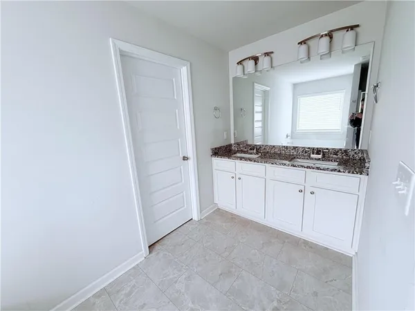 a view of cabinets with wooden floor