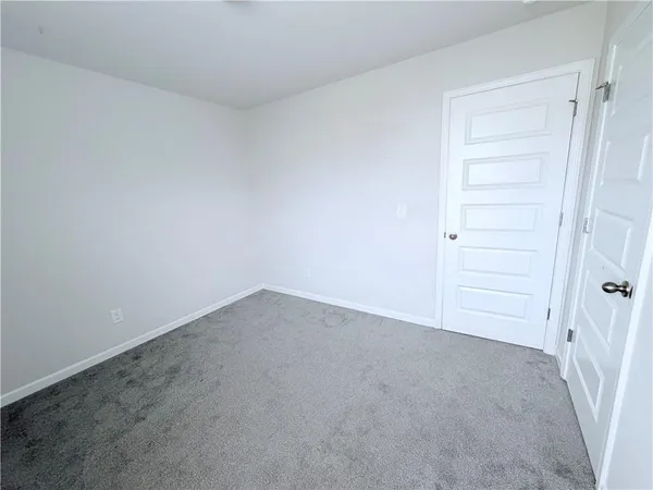 an empty room with a hallway