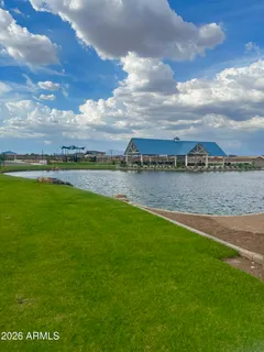 a view of a lake with houses in the back