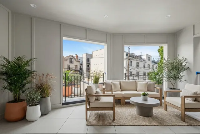 a view of a hallway with stairs