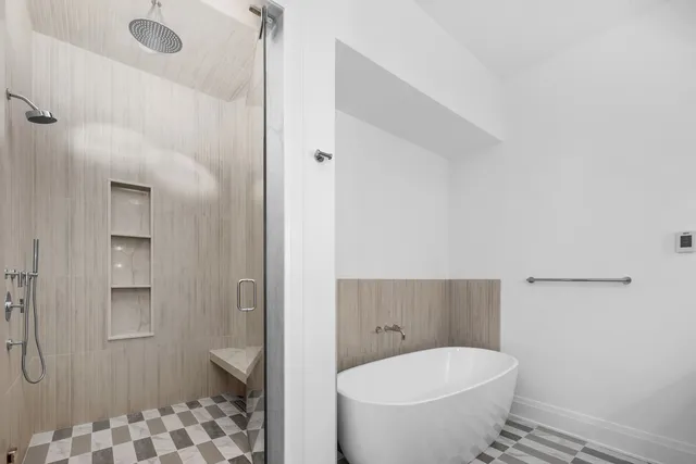 a bathroom with double vanity sinks and a mirror