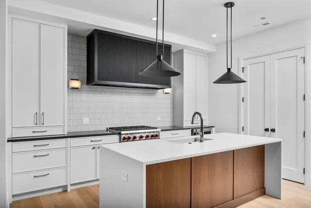 a kitchen with a sink and a refrigerator
