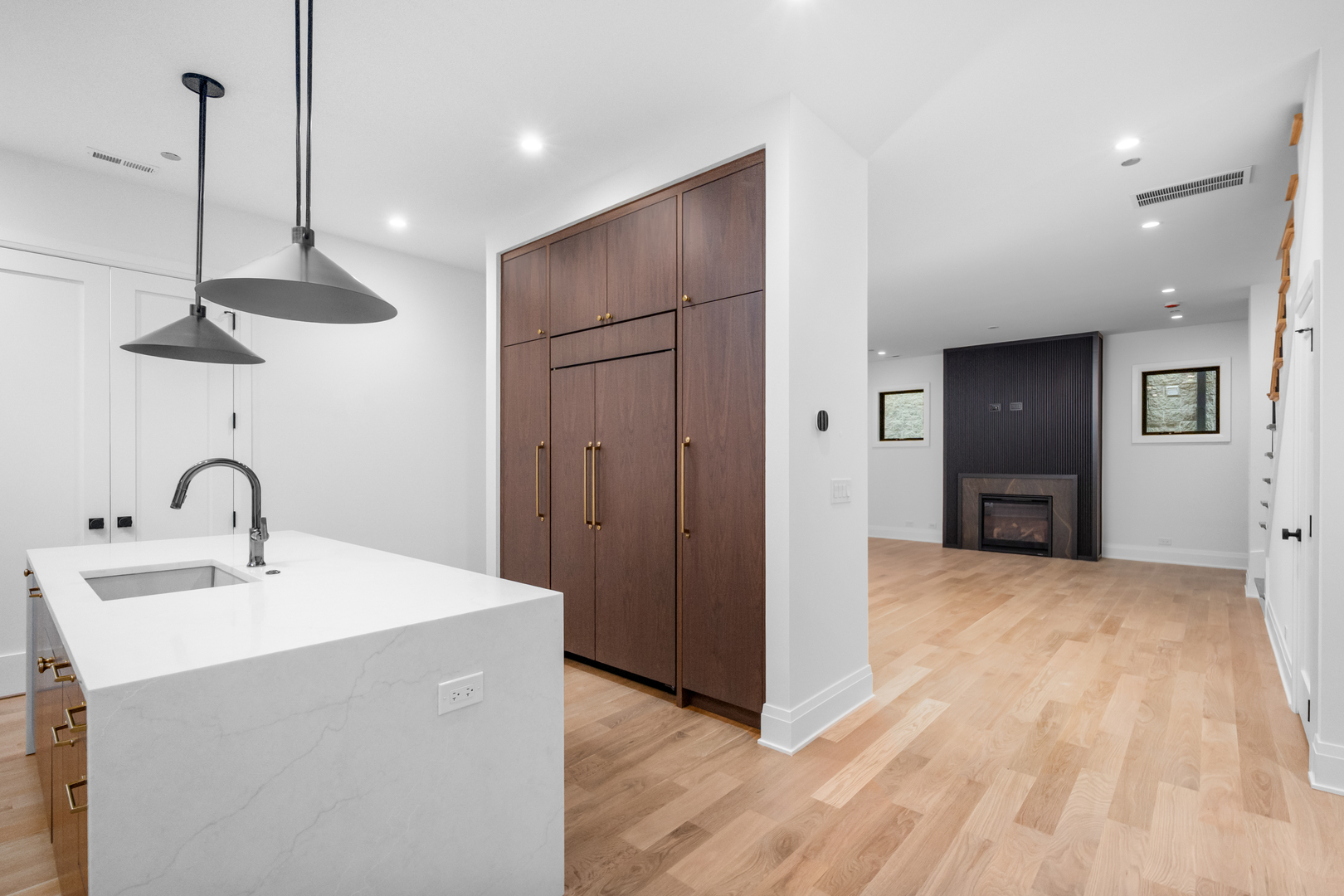 2832 North Racine Avenue, Unit 2W Chicago, IL 60657 - Photo 9 of 31 a kitchen with stainless steel appliances a sink and wooden floor