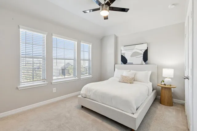 a bedroom with a bed and window